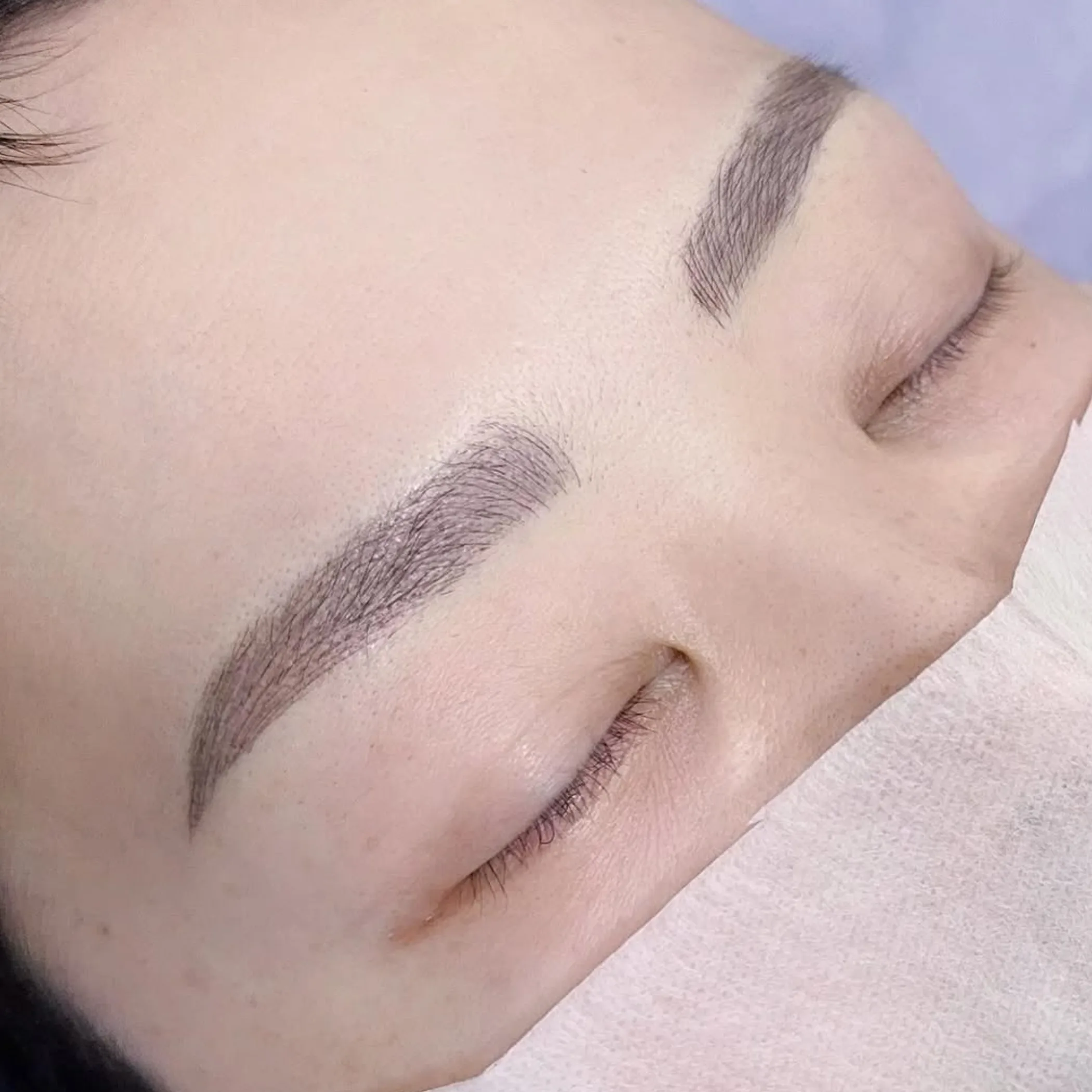 microblading procedure on eyebrow