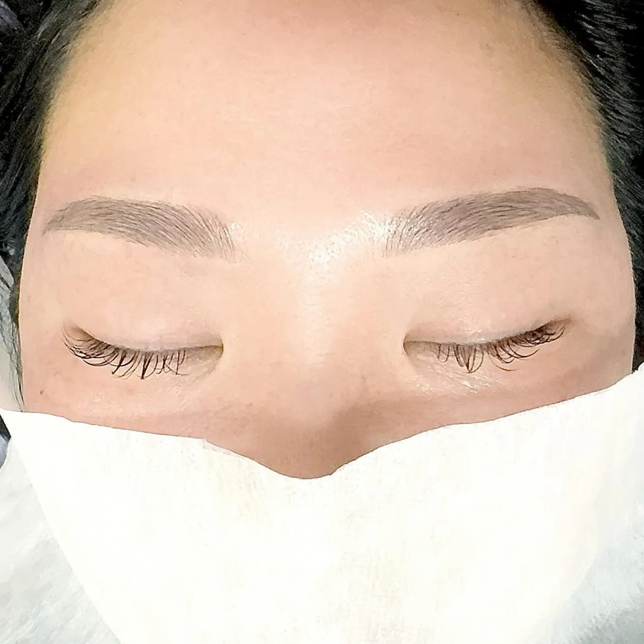 close-up of microbladed eyebrows and lash line
