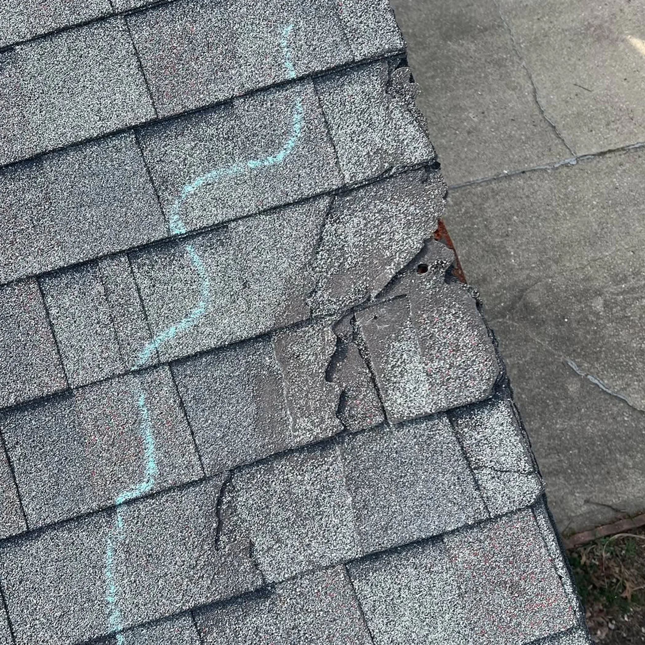 damaged shingles after storm