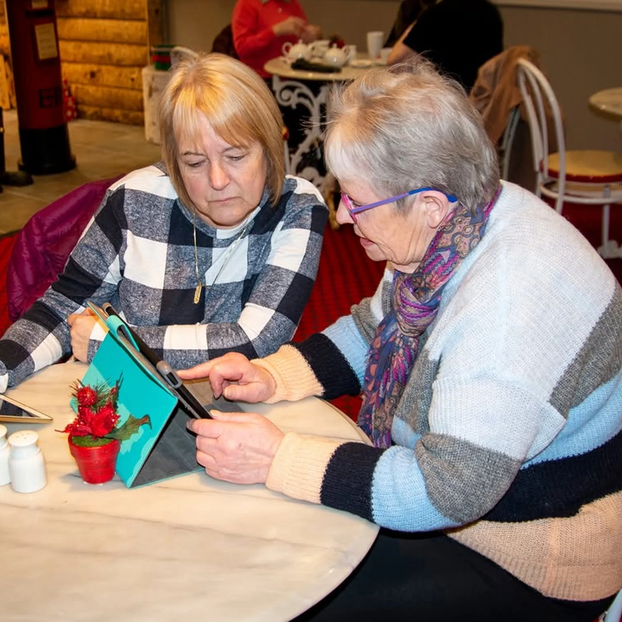older women using tablets for digital learning